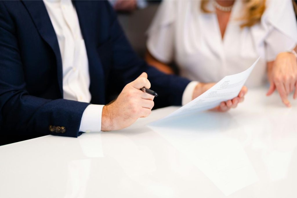 Signing documents at a table