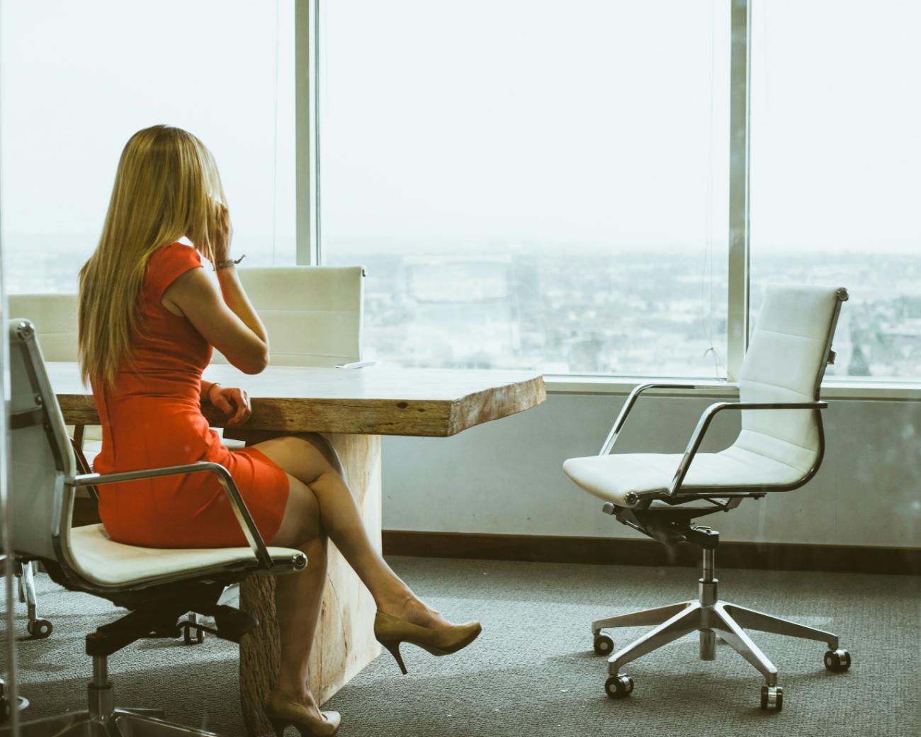 Woman in red dress sitting